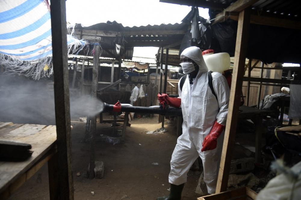 An informal market in the Anyama district of Abidjan, Ivory Coast, is sanitized on 25 April 2020, against the Coronavirus COVID-19.  By Sia Kambou / AFP