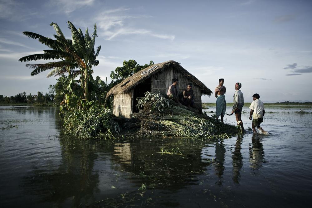 This flooded village was pictured by Jonas Bendiksen in Genduram in the Gaibandha district, in Bangladesh, in 2010.