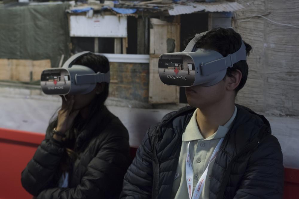 The above scene of young people wearing augmented reality masks was taken during the 33rd International Conference of the Red Cross and Red Crescent, in Geneva, in 2019.